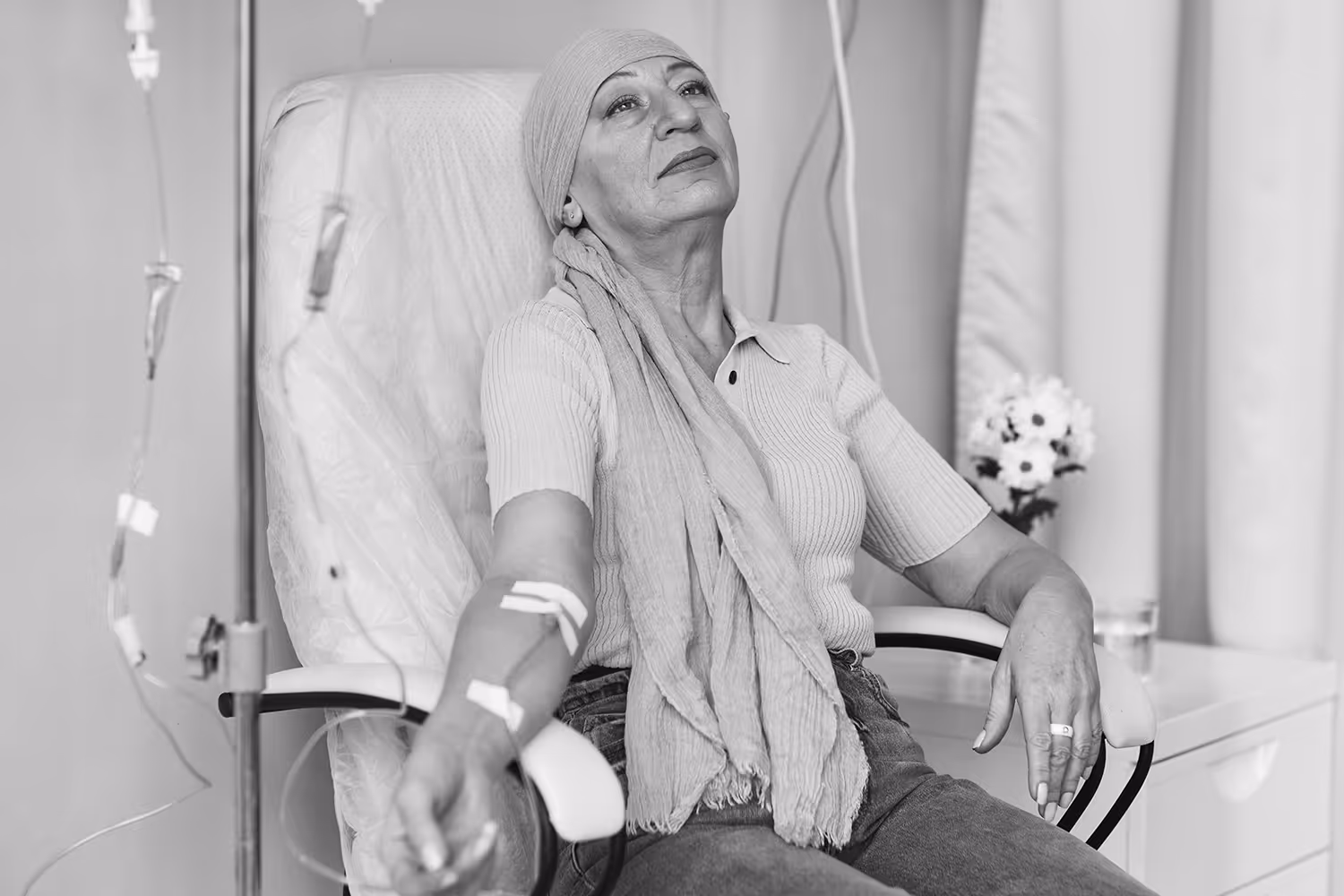Woman getting IV in hospital for cancer treatment