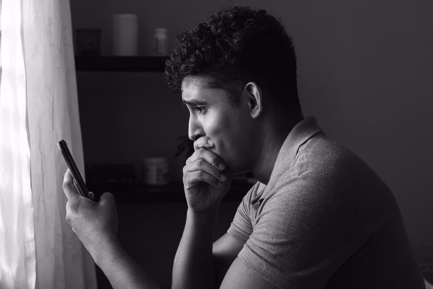 Man getting news about cancer diagnosis sitting in bed