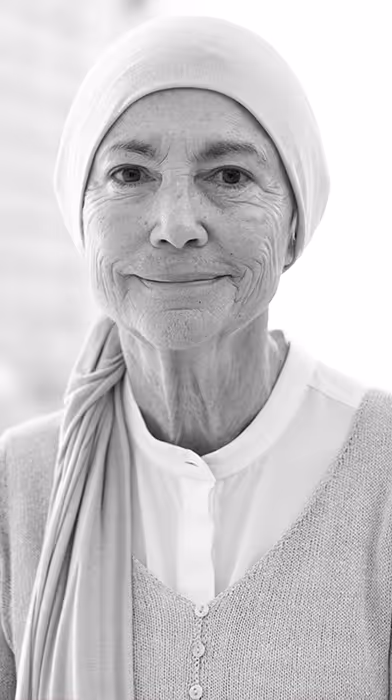 Older woman with cancer looking at camera