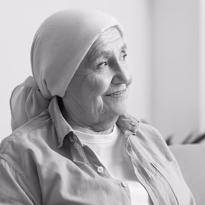 Elderly woman with cancer looking off camera