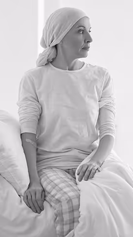 Woman with cancer in hospital bed