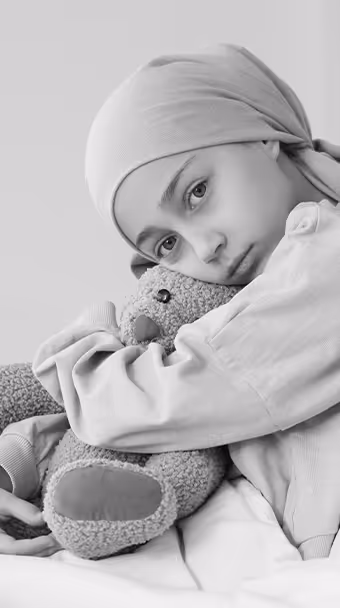 Young child holding teddy bear