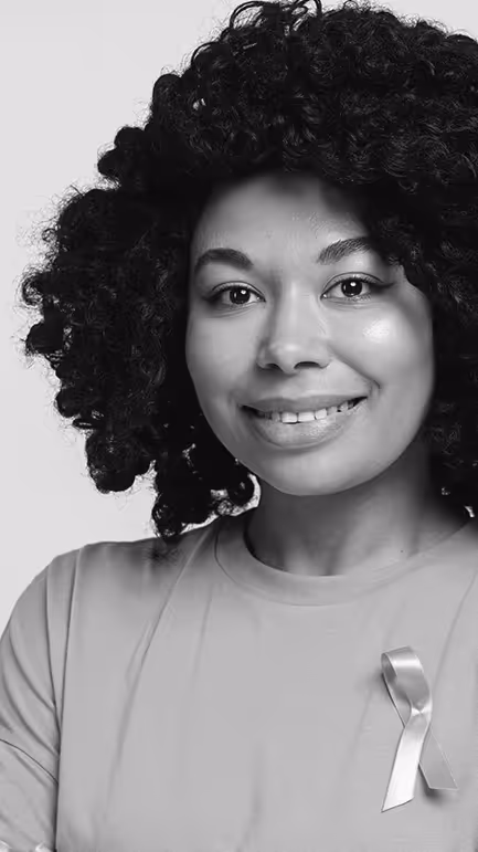 Black woman wearing cancer ribbon