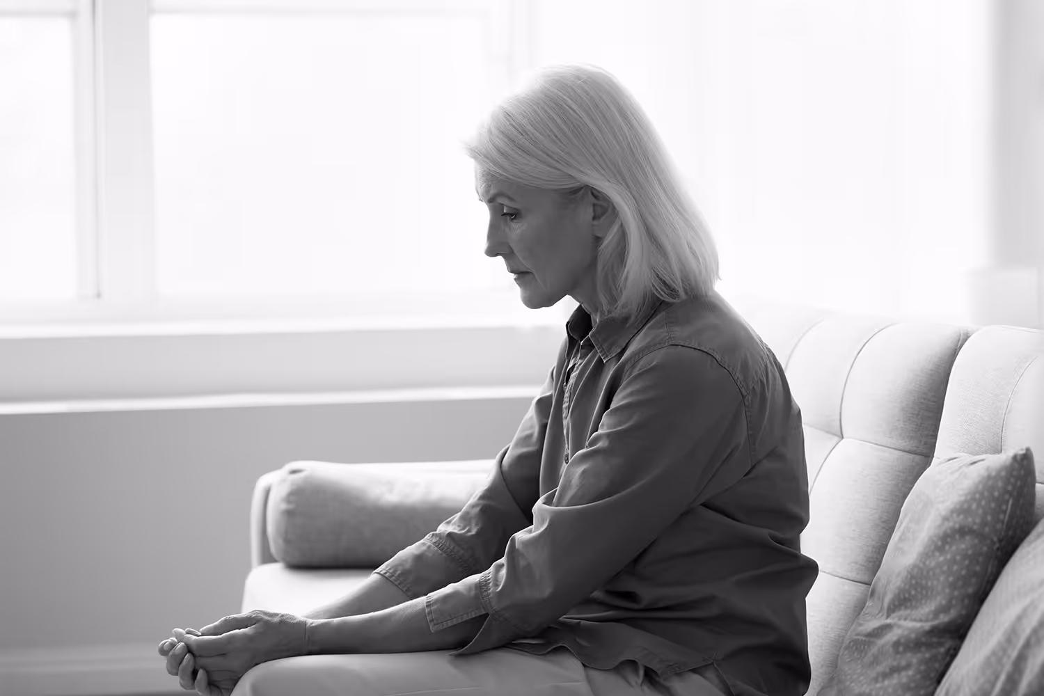 Sad woman on couch