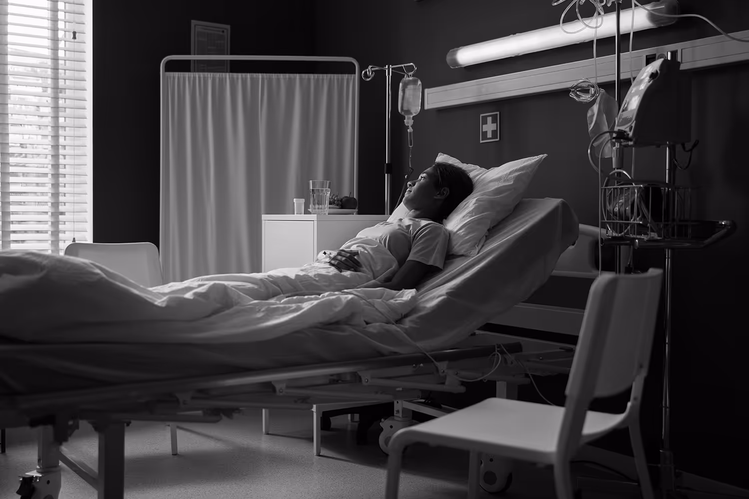 Woman laying in hospital bed